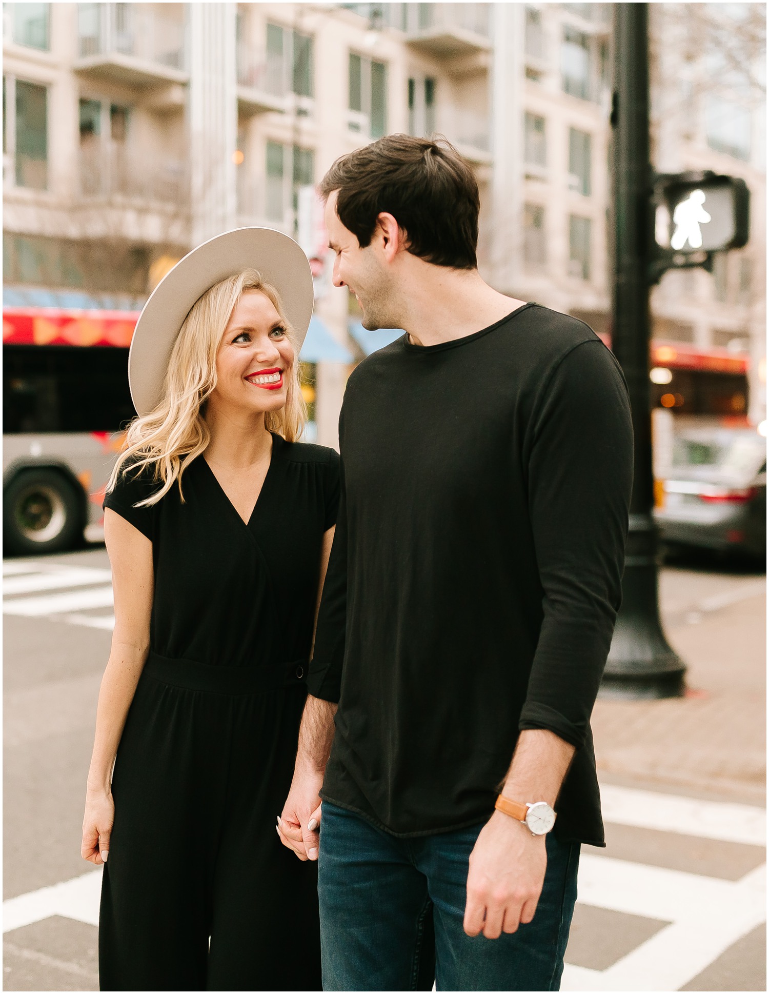engaged couple walks on street in Raleigh NC during engagement session