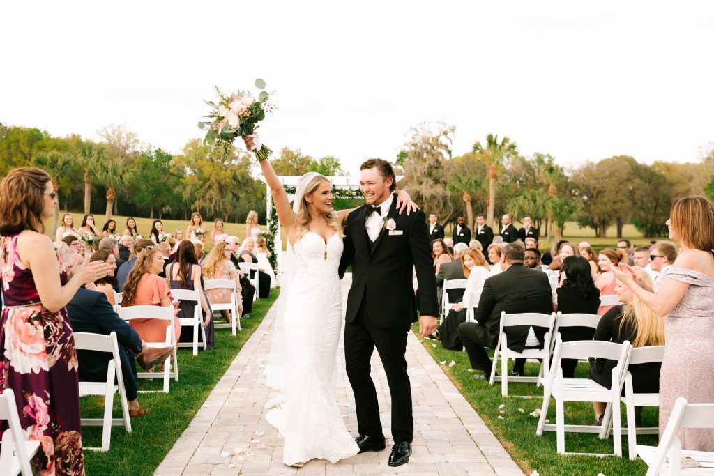 couple walking down the aisle after ceremony