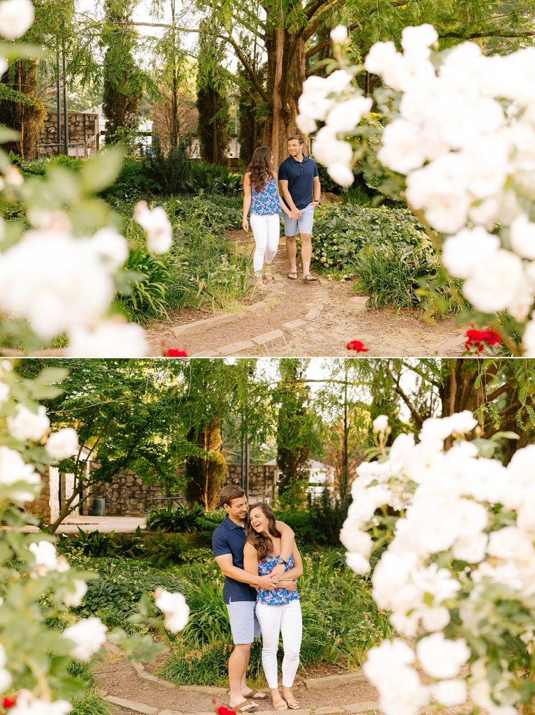 engagement portraits among white flowers at Raleigh Rose Garden