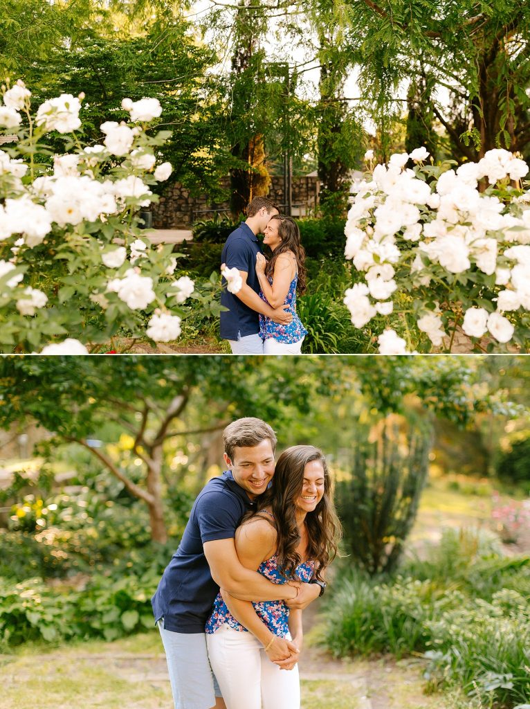 groom hugs bride to be during engagement portraits at Raleigh Rose Garden