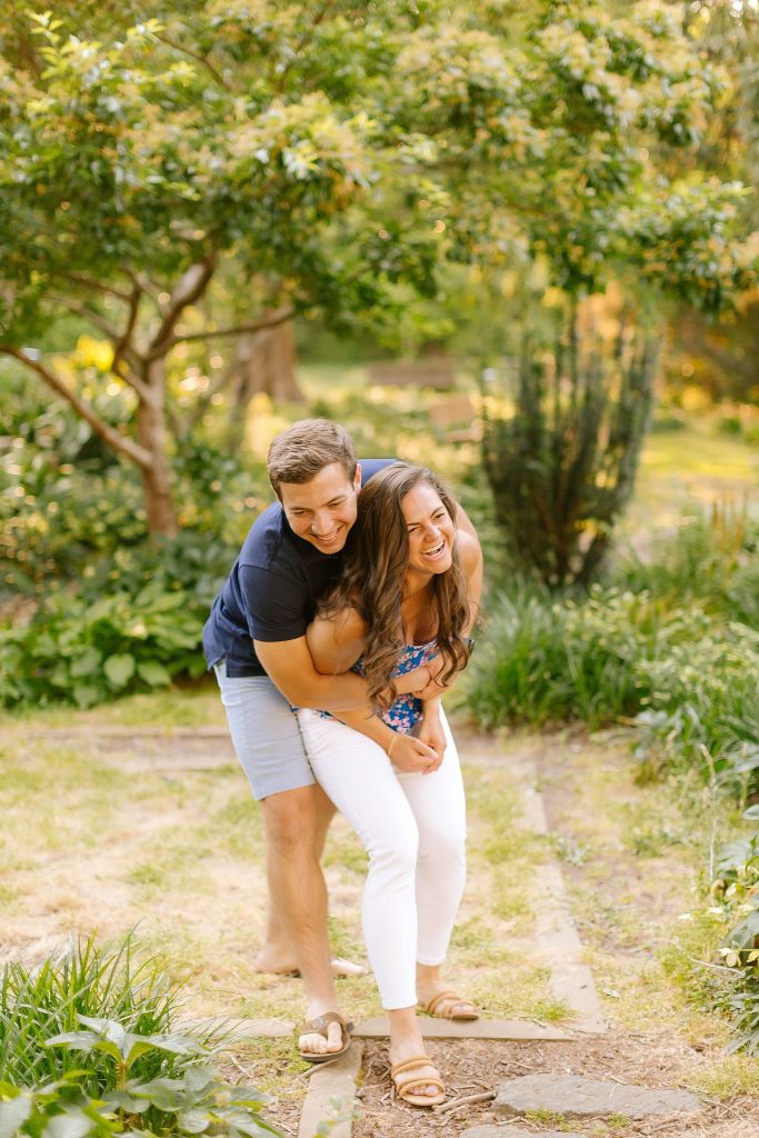 bride and groom laugh during North Carolina engagement portraits