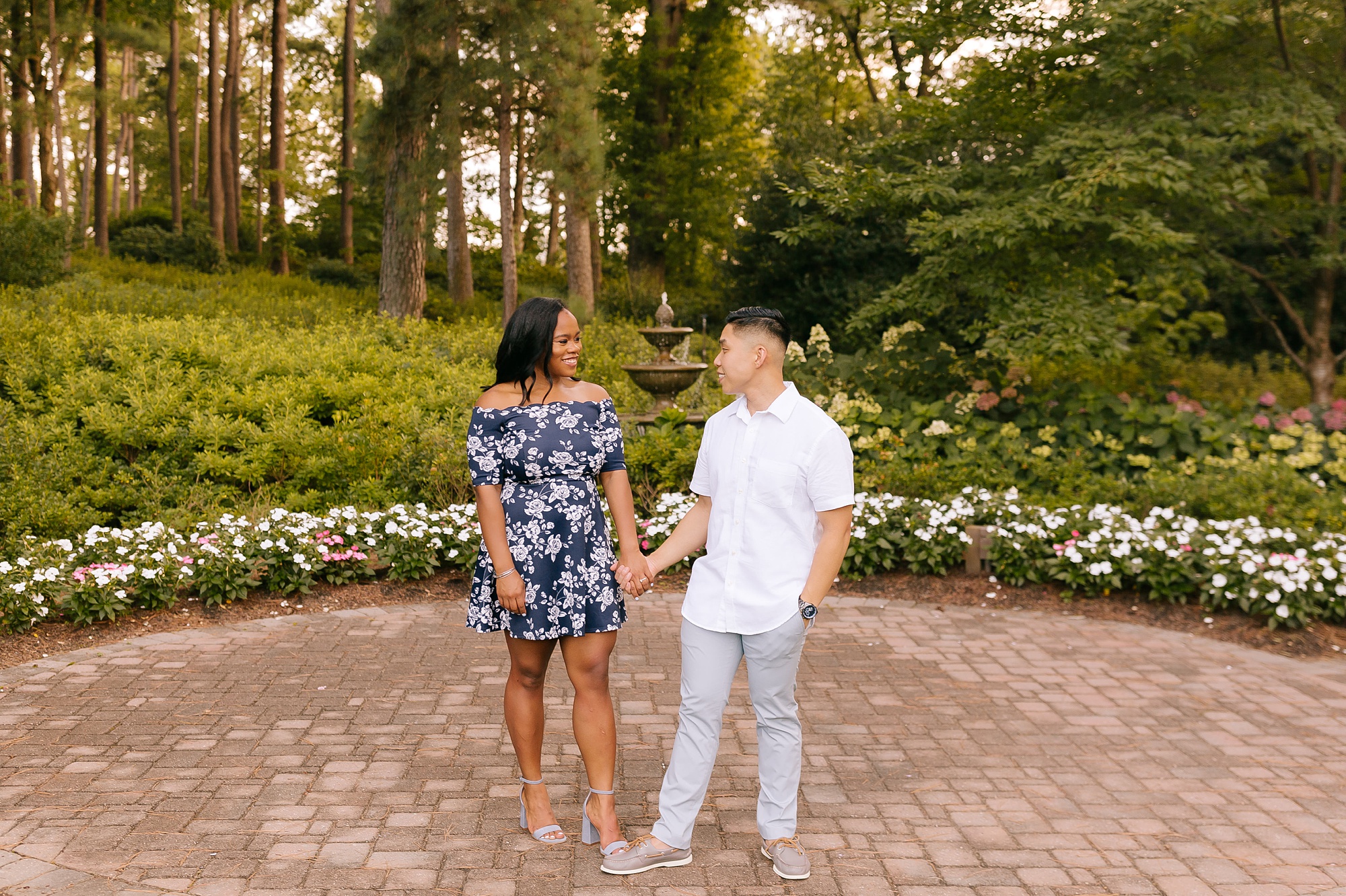 summer engagement session by fountain in RAL NC