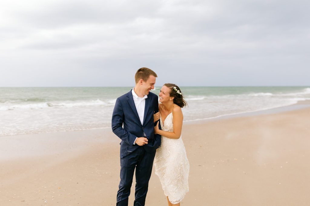 newlyweds laugh during storm at Ocracoke Island
