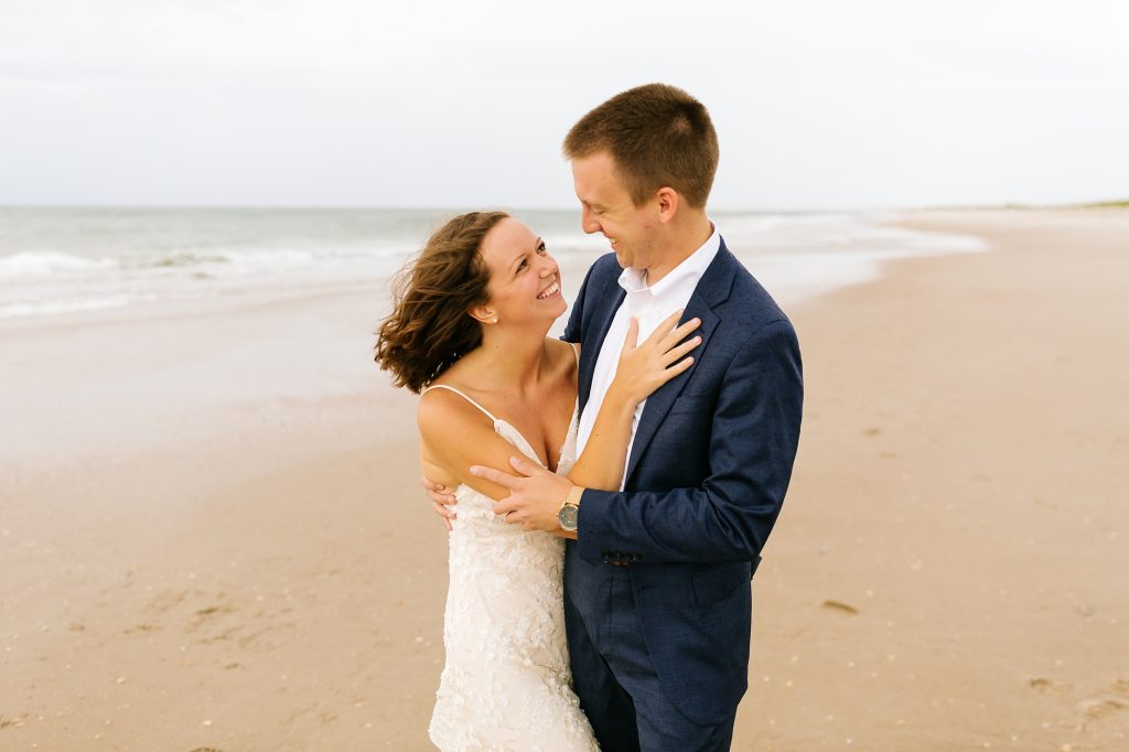 bride and groom hug during Ocracoke Island wedding photos