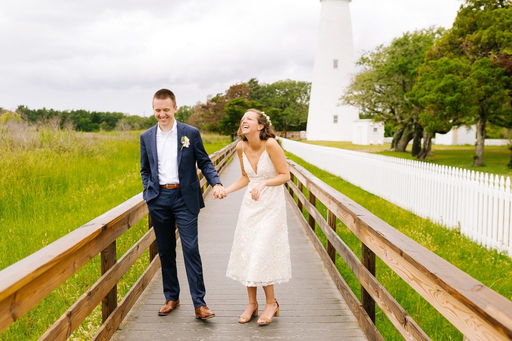 Ocracoke Lighthouse wedding photos of bride and groom laughing 