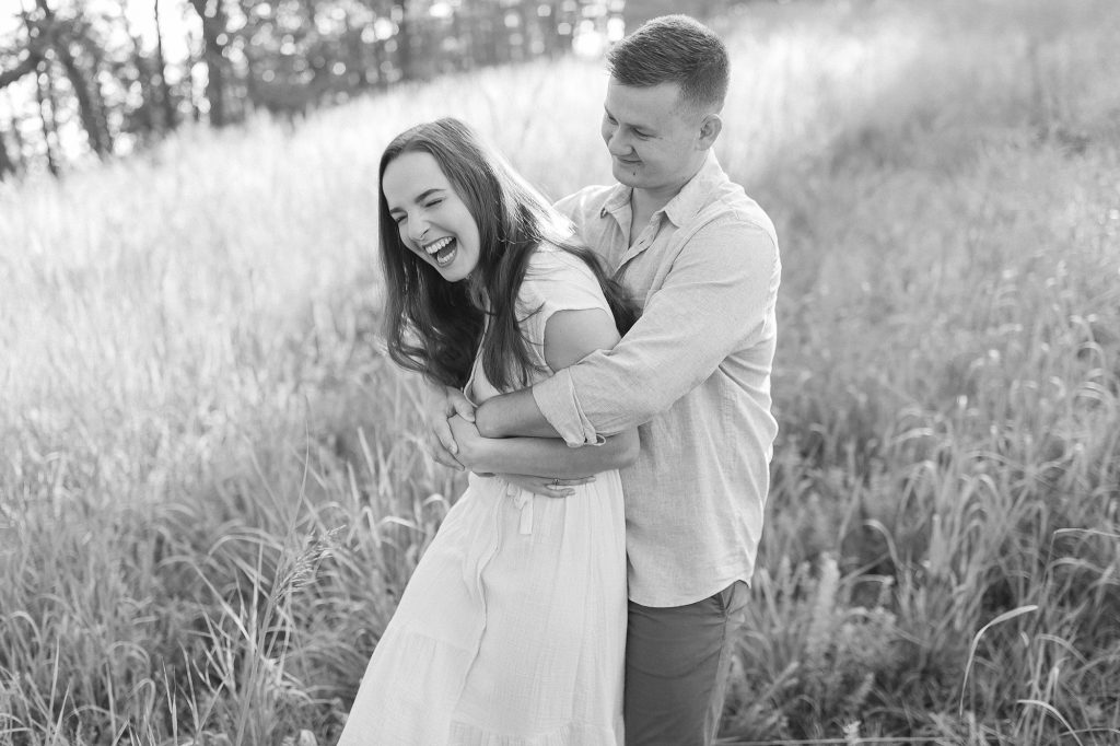 couple laughs during NC engagement photos
