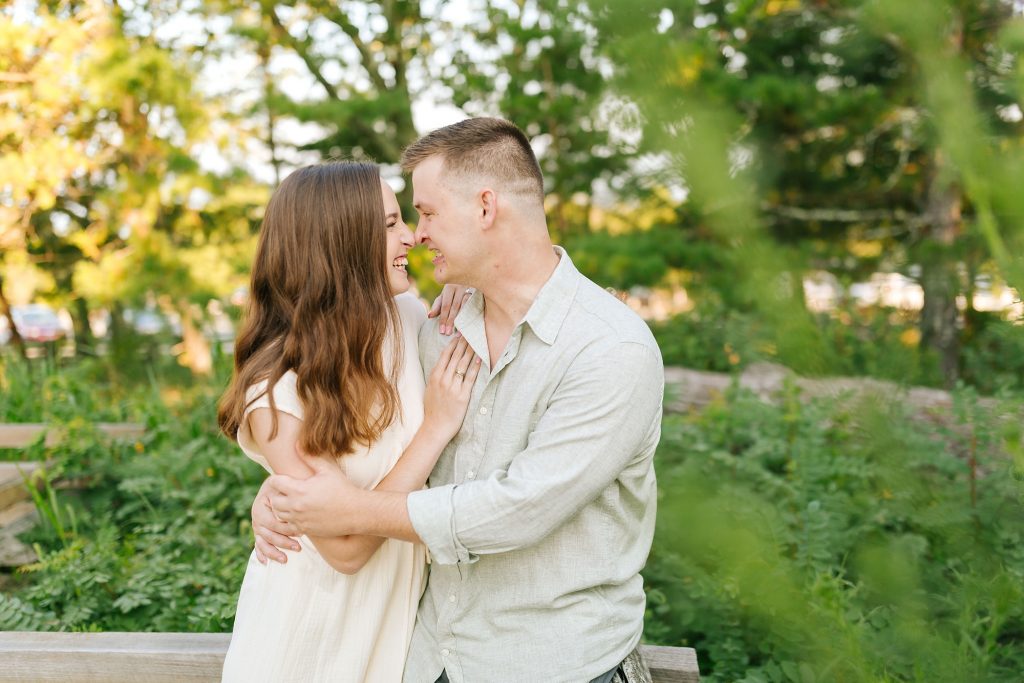 bride and groom laugh during engagement photos