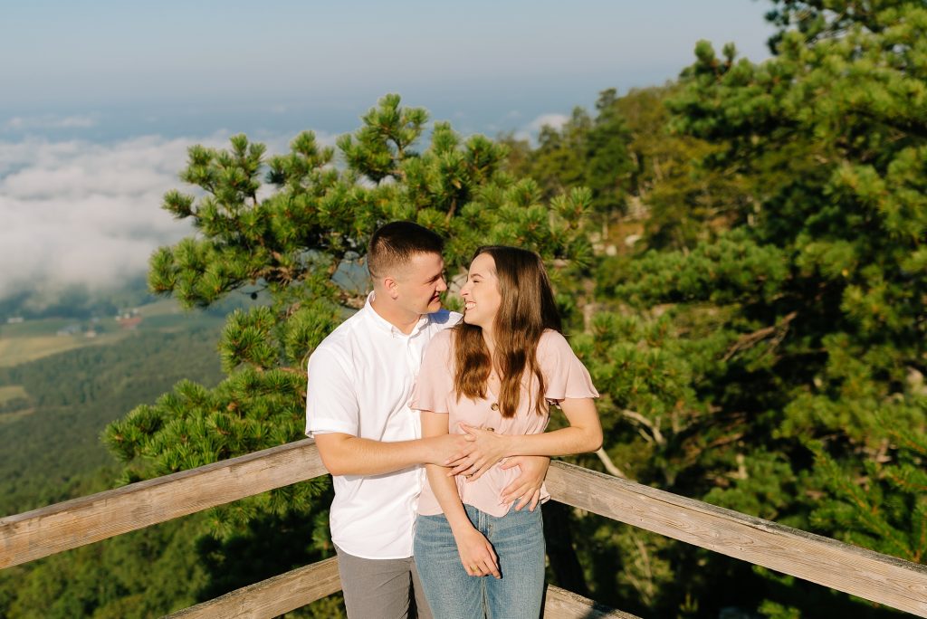 bride and groom pose overlooking NC mountain