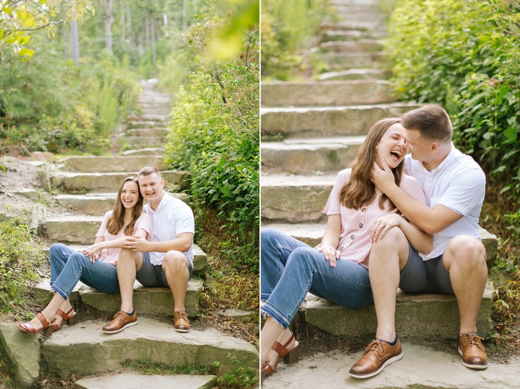 bride and groom laugh sitting on steps on mountaintop