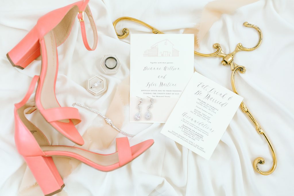New Jersey wedding day details with invitation and pink shoes