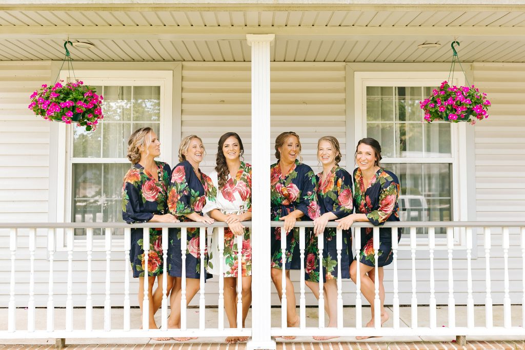 bridesmaids pose on front porch in New Jersey