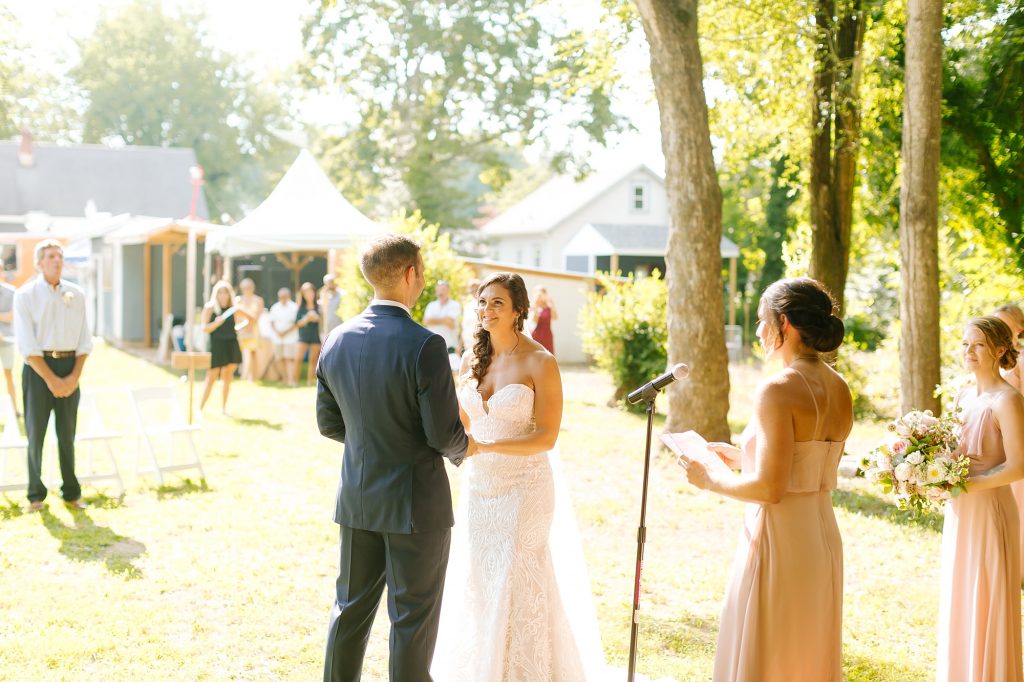 bride and groom exchange vows during backyard wedding in Vineland NJ