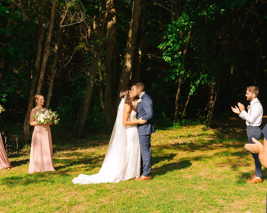 bride and groom kiss after wedding ceremony in New Jersey