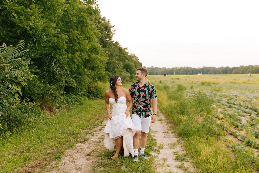 New Jersey couple walks during wedding portraits after ceremony