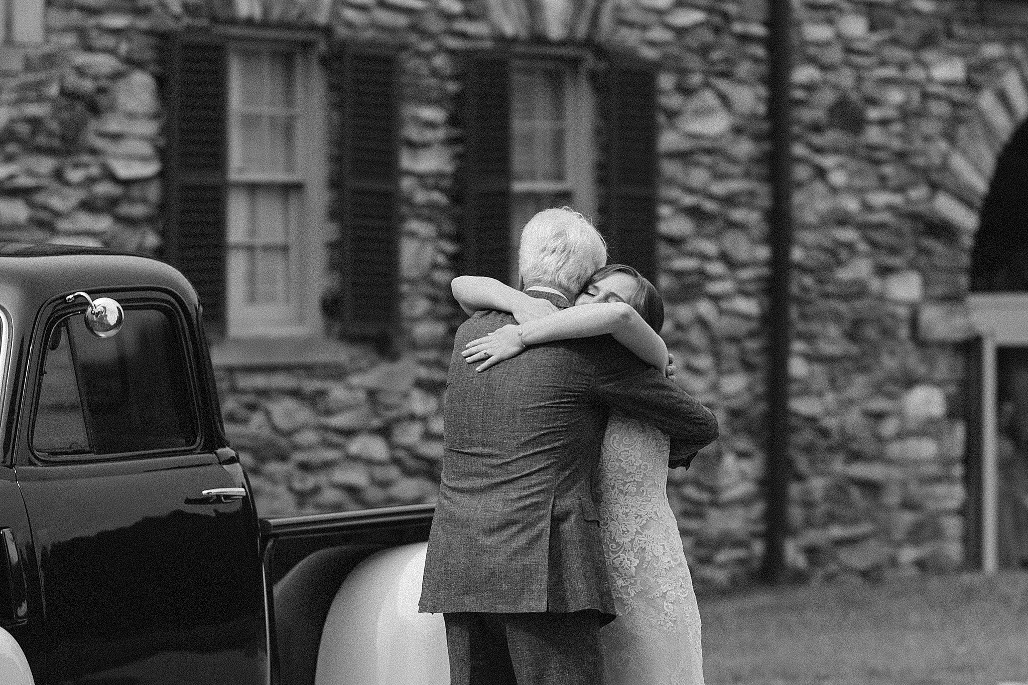 bride and dad hug during first look