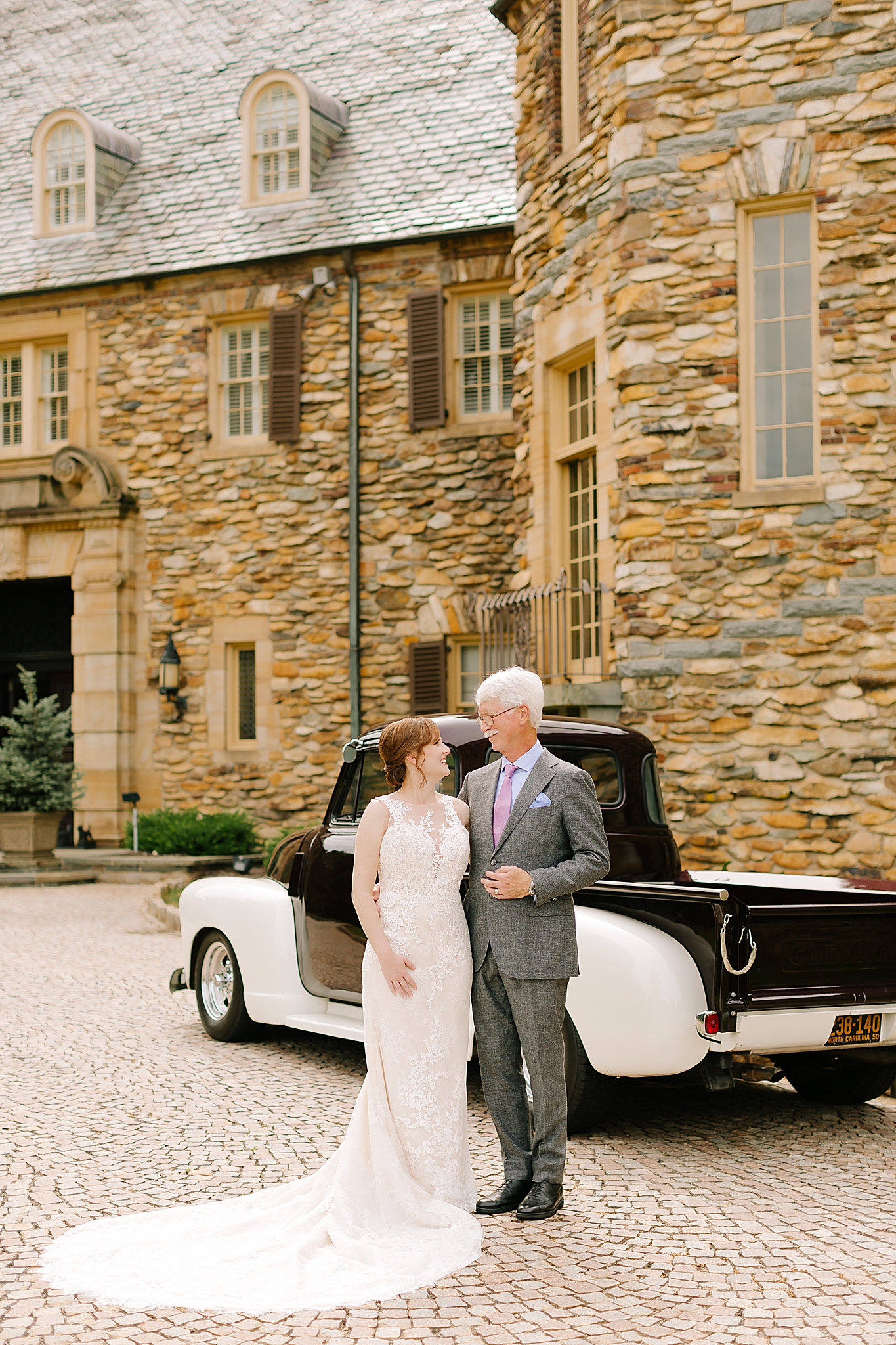 bride and dad pose after first look