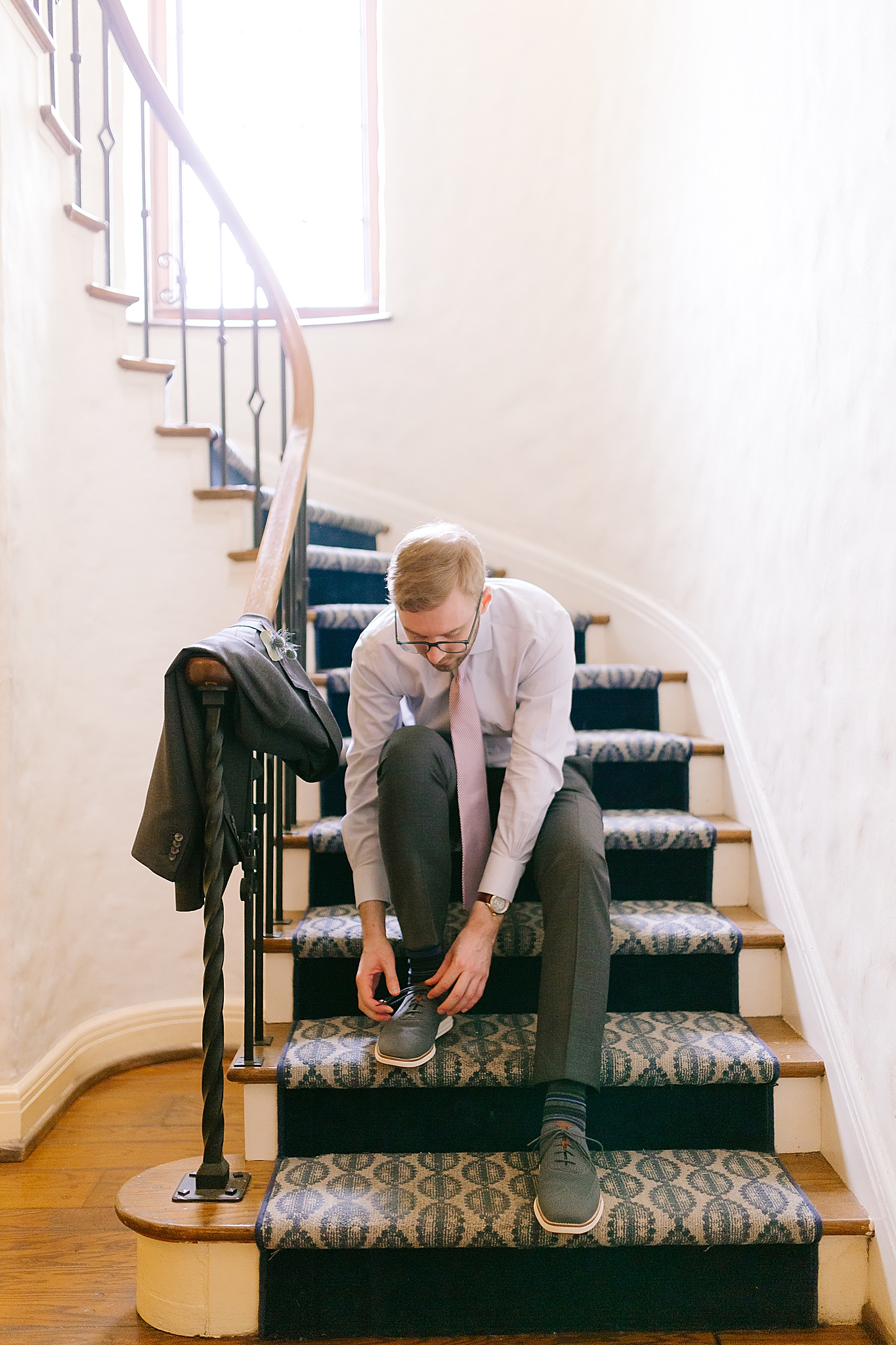 groom puts on socks and shoes