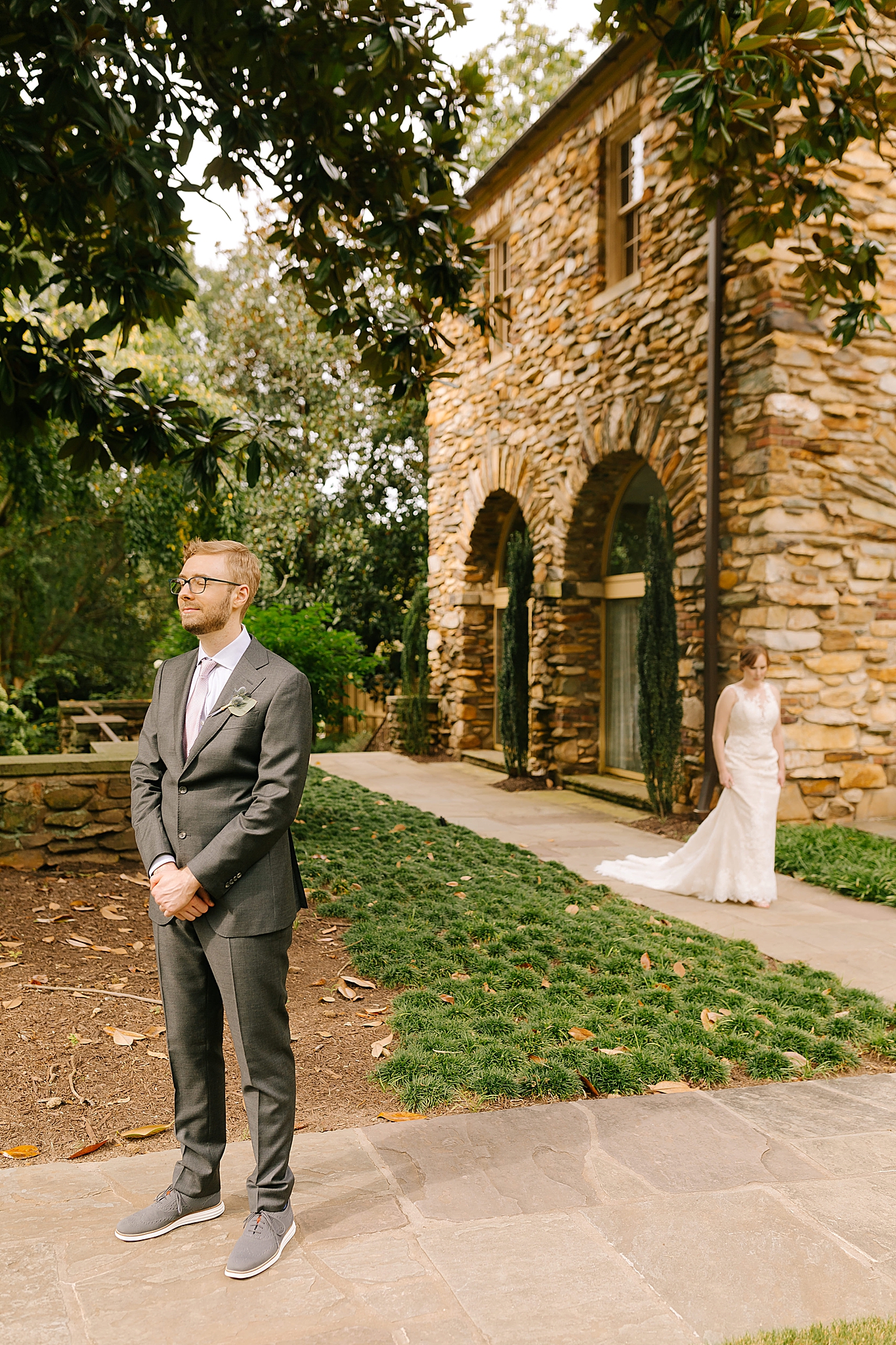 bride approaches groom for first look before Microwedding at The Graylyn Estate