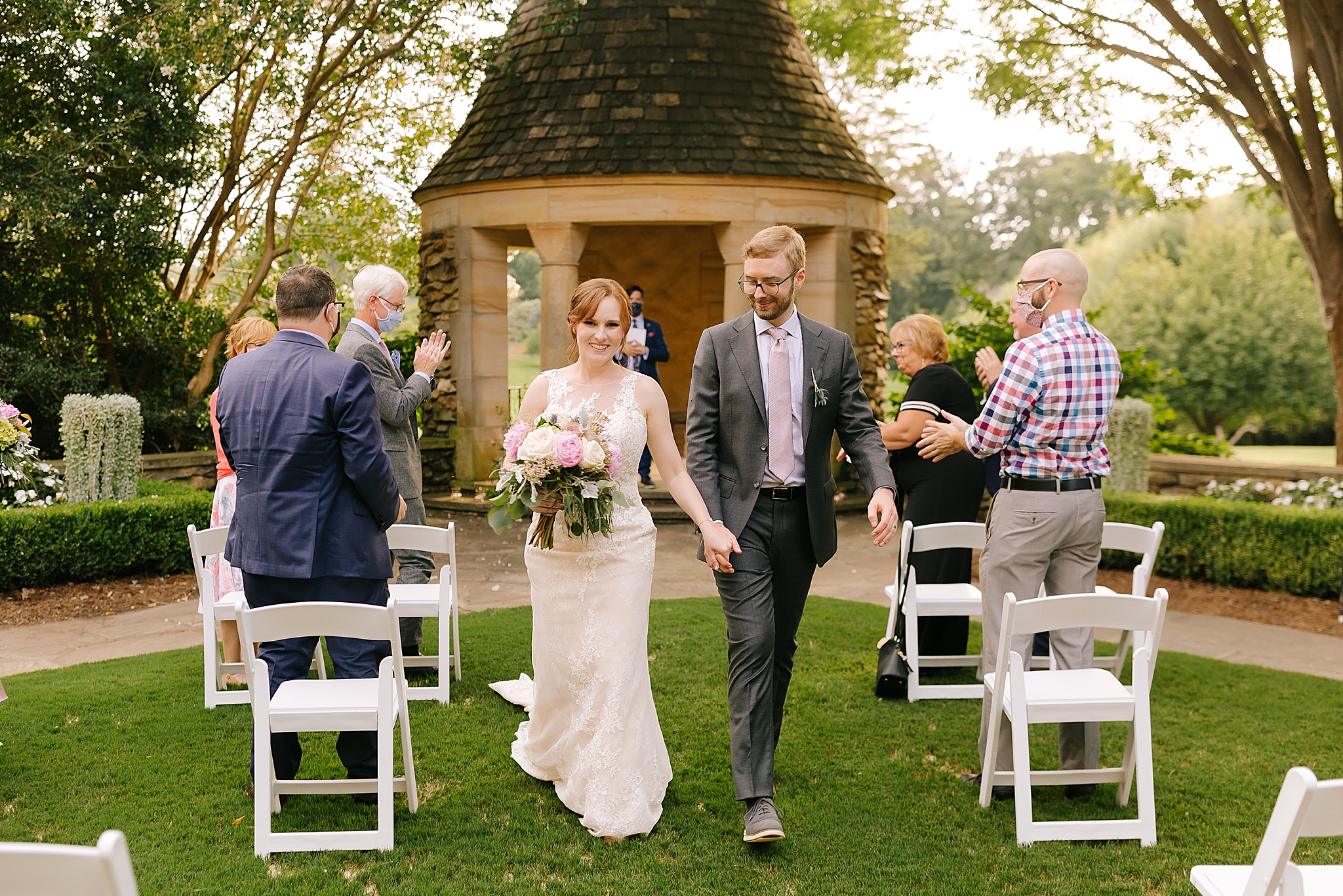 bride and groom recess up aisle after Graylyn Estate wedding ceremony