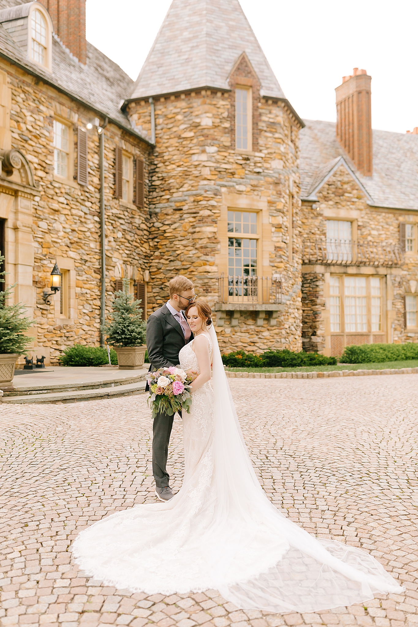 newlyweds pose outside Winston-Salem historic home