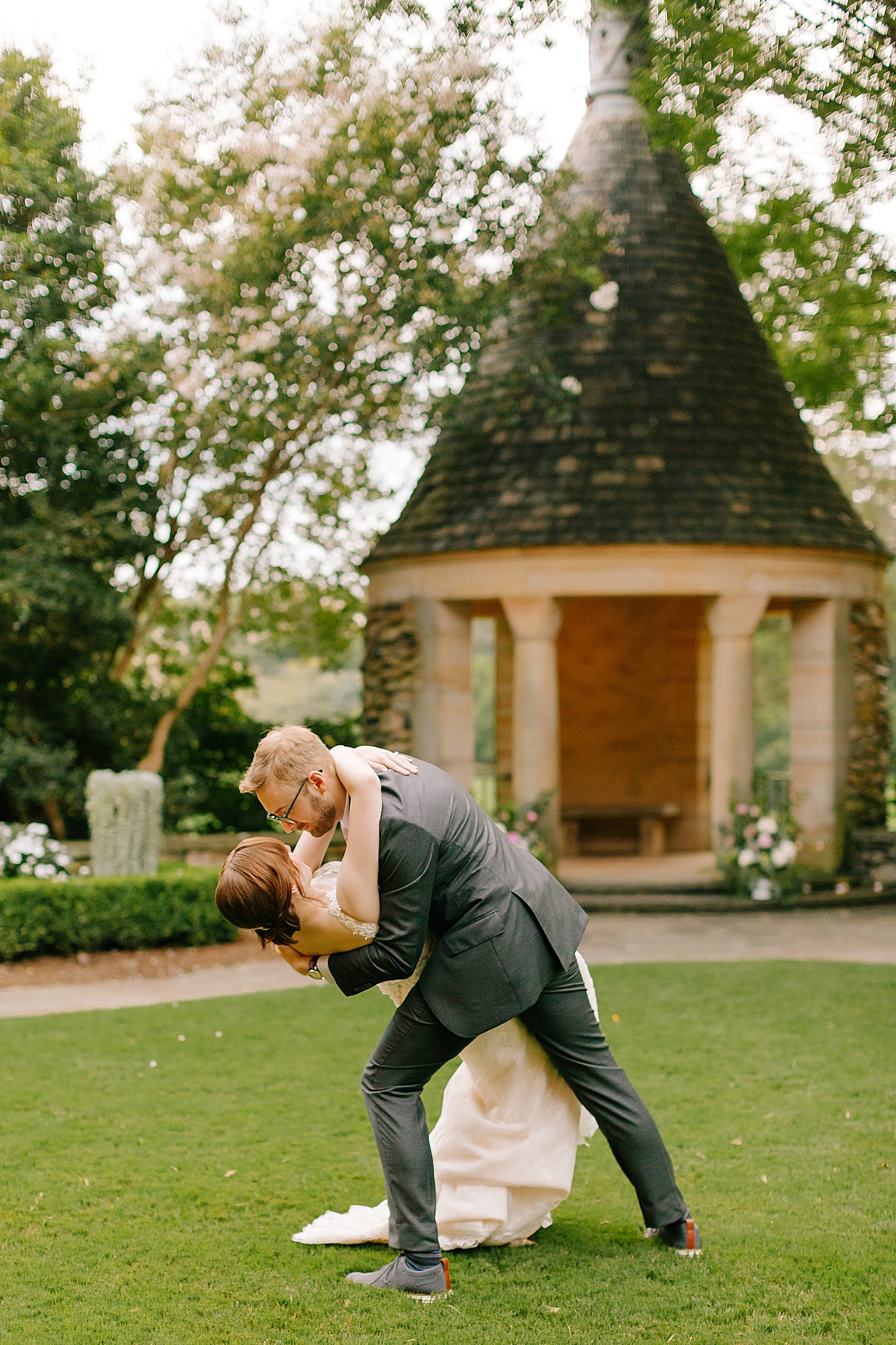 groom dips bride during first dance 