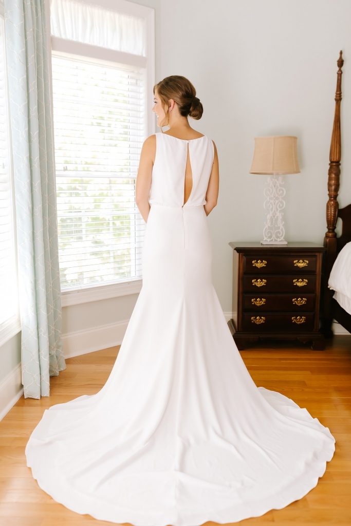 bridal portrait of back of gown in childhood bedroom