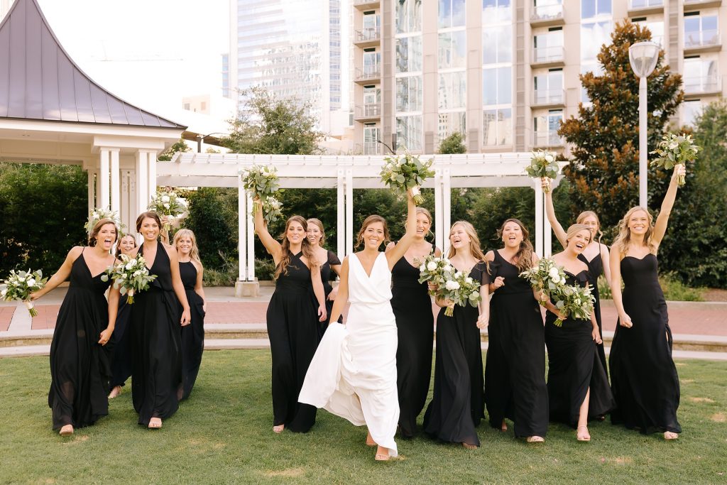 bride and bridesmaids cheer during portraits