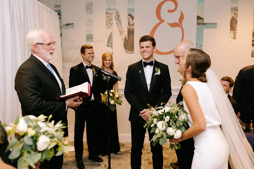father gives bride away during microwedding in Uptown Charlotte