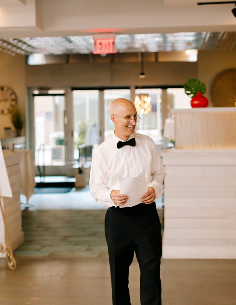 dad gives toast during Uptown Charlotte wedding reception