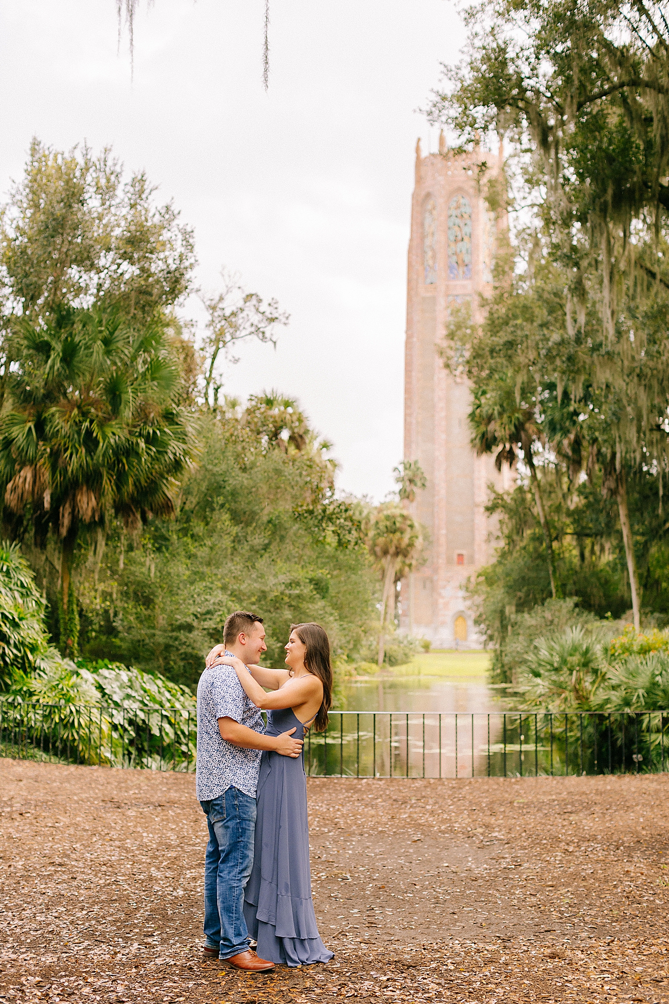 couple poses in front of Bok Tower