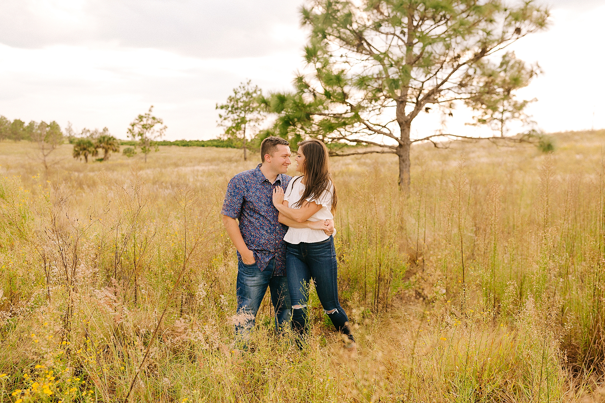 engaged couple stands nose to nose during Bok Tower engagement portraits 