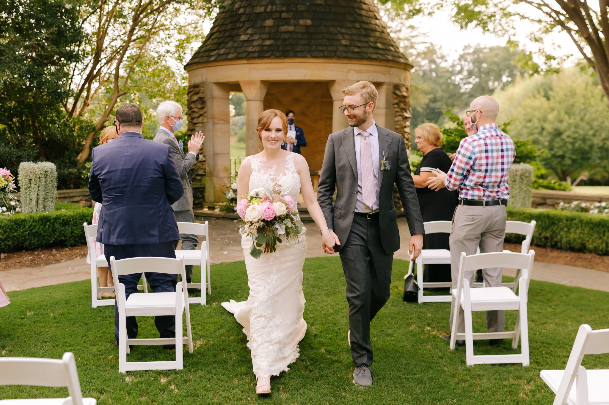 Couple is announced married as they walk down the aisle at the Graylyn Estate in Winston-Salem, NC