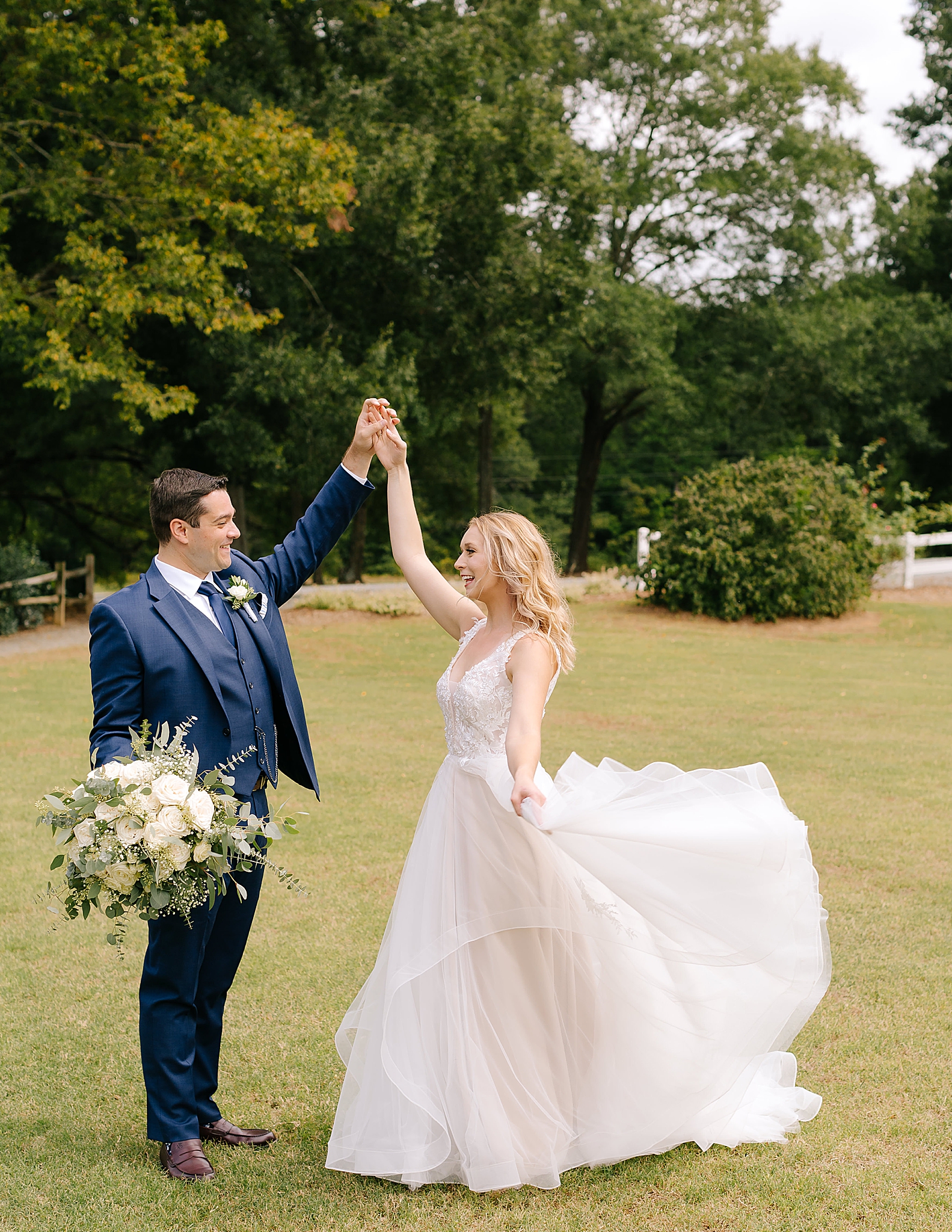 bride and groom dance during wedding photos at Camellia Gardens