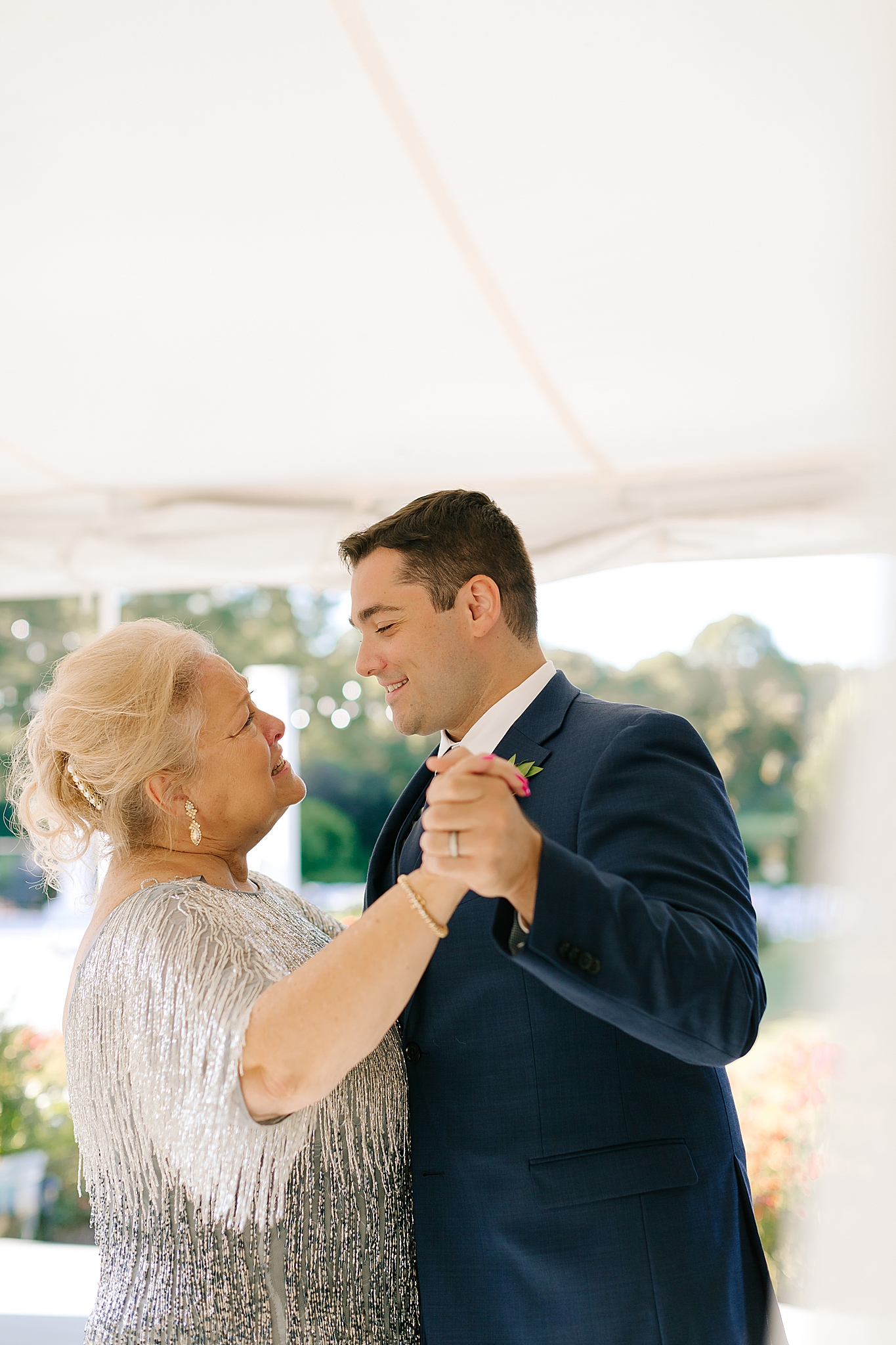groom dances with mom during Camellia Gardens wedding reception