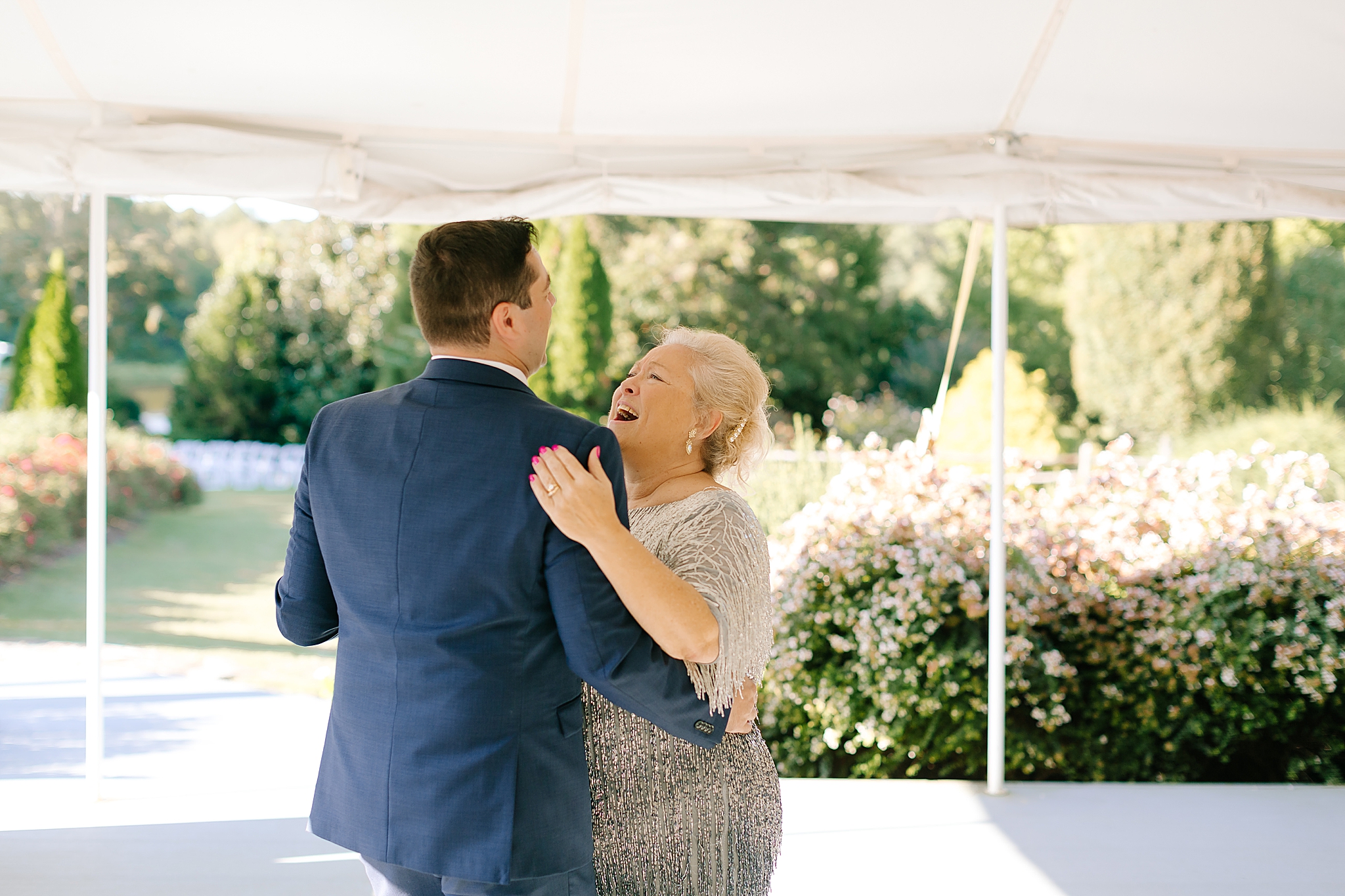 groom and mom dance during NC wedding reception