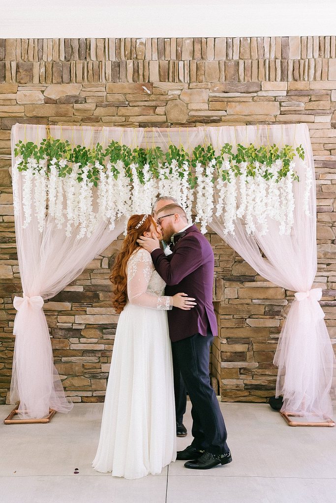 bride and groom kiss at the end of Southern Charm Events wedding ceremony