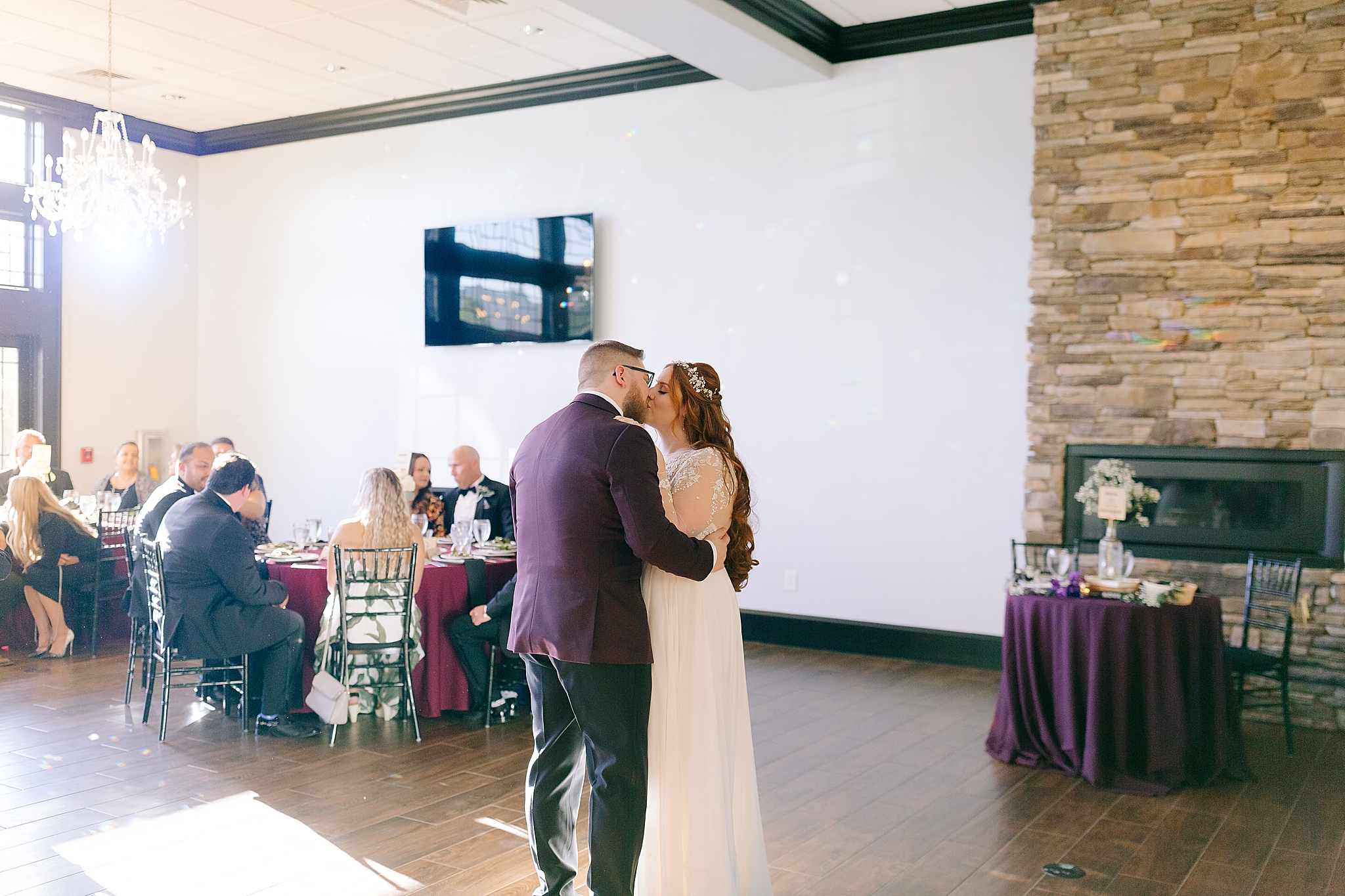 groom kisses bride during first dance