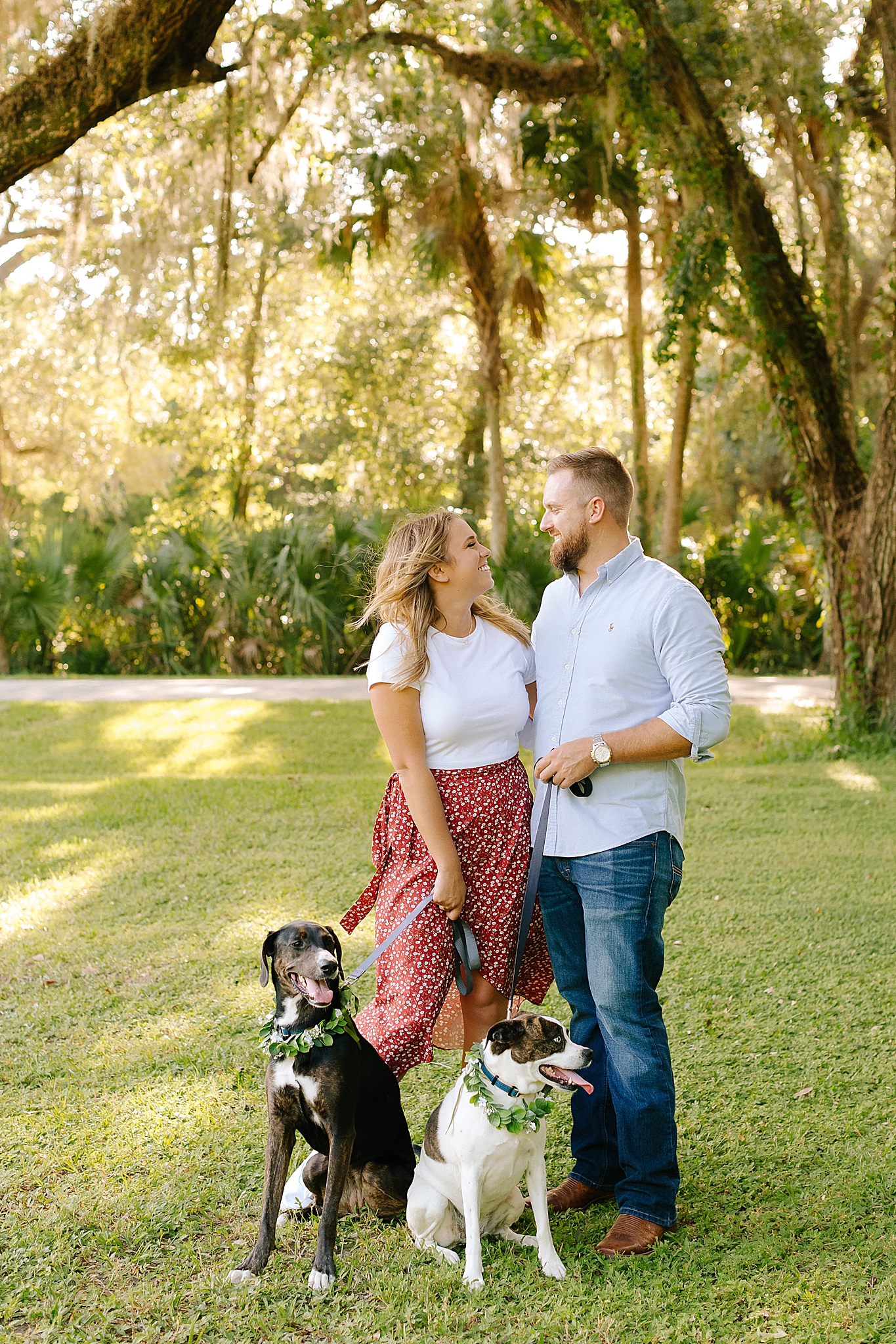 bride and groom look at each other during Washington Oaks Gardens engagement session