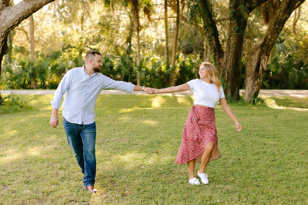 engaged couple dances during Florida engagement photos