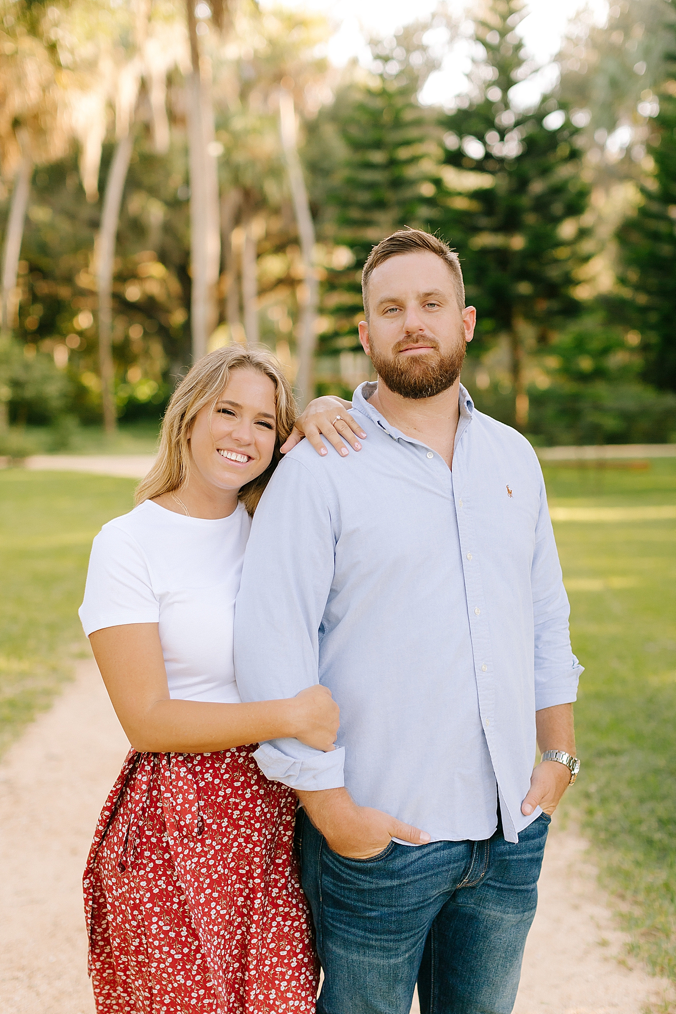 bride leans against groom during Washington Oaks Gardens engagement session