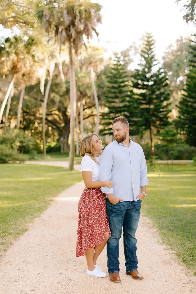 bride and groom walk through Washington Oaks Gardens