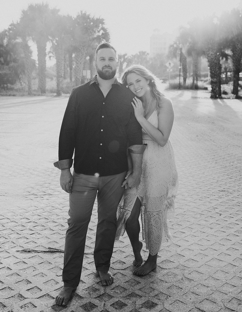 bride and groom pose in parking lot of Palm Coast