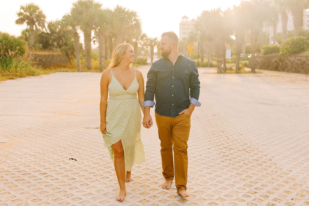 engaged couple walks through Palm Coast