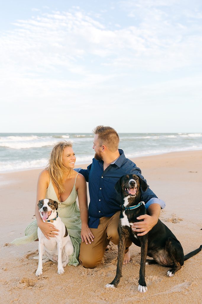 bride and groom pose with dogs