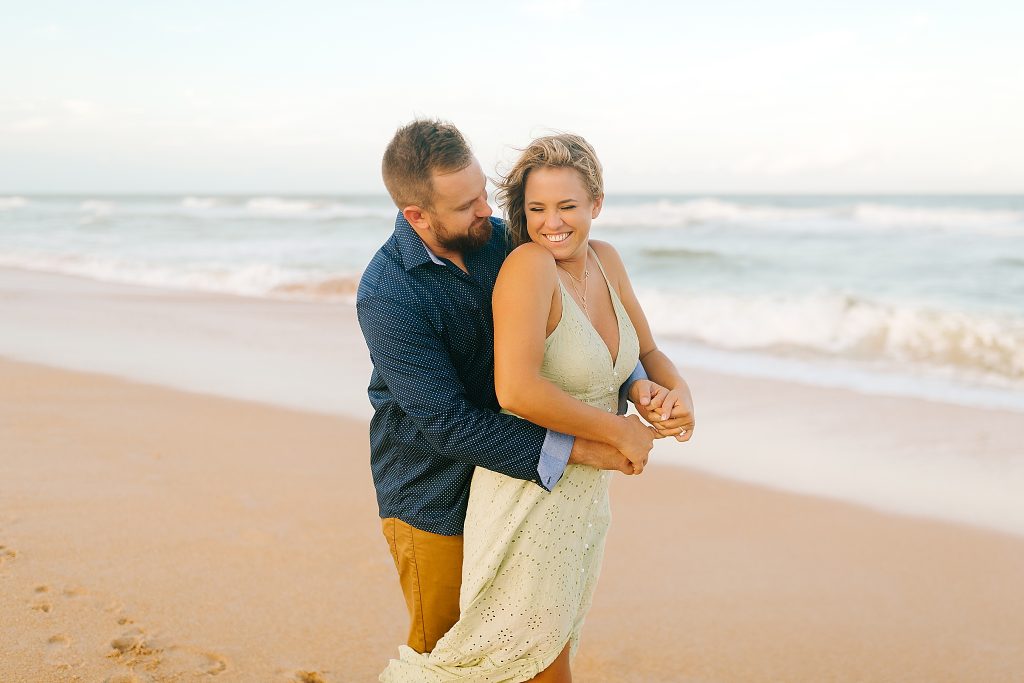 groom hugs bride on Palm Coast beach