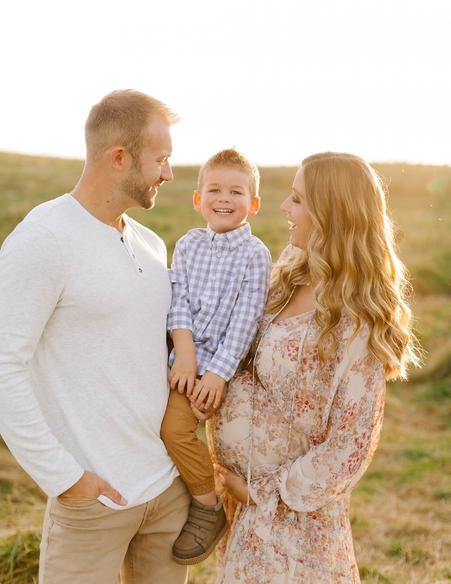 parents smile with son during Asheville maternity session