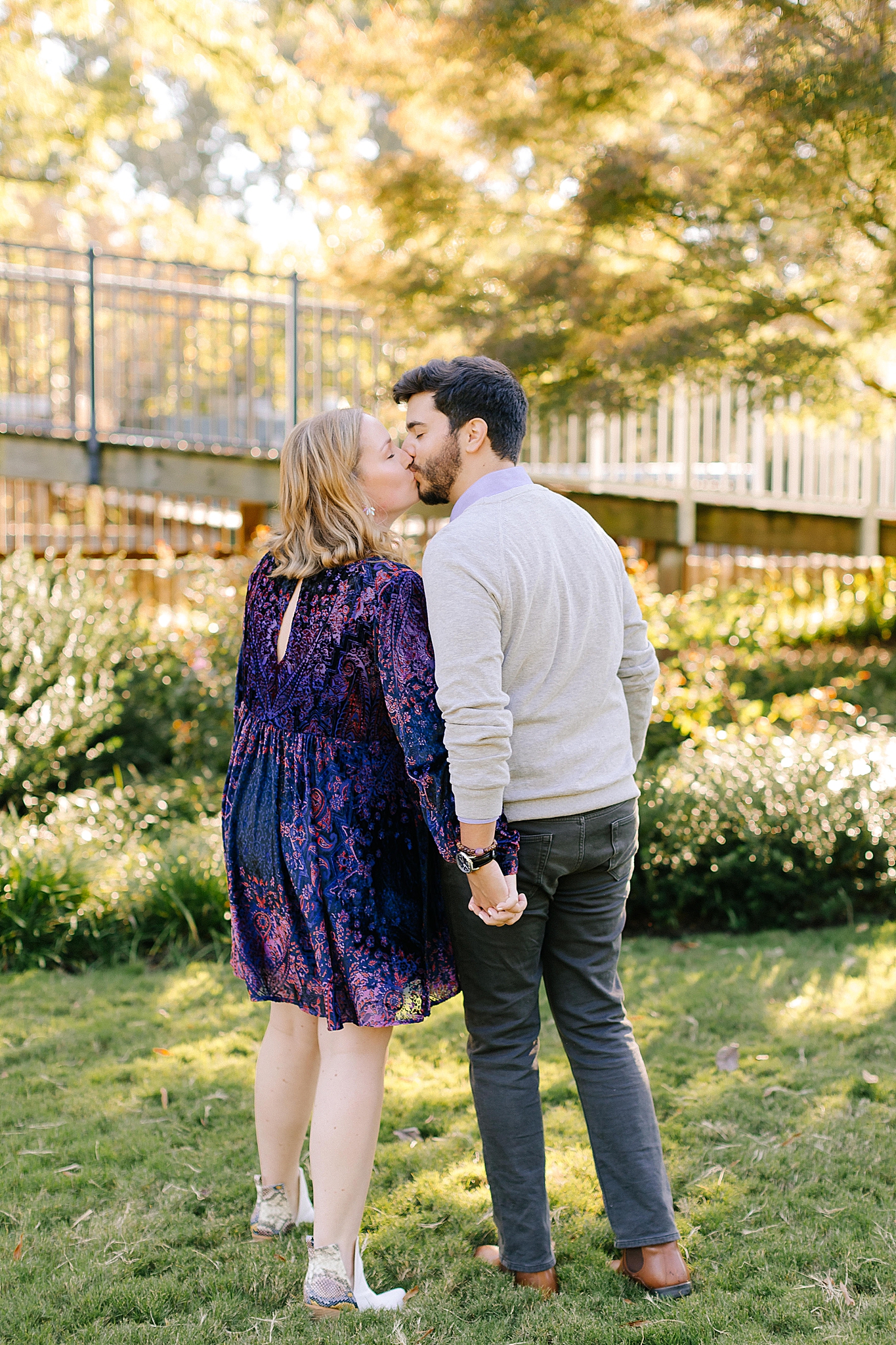 NC couple kisses during Raleigh engagement photos