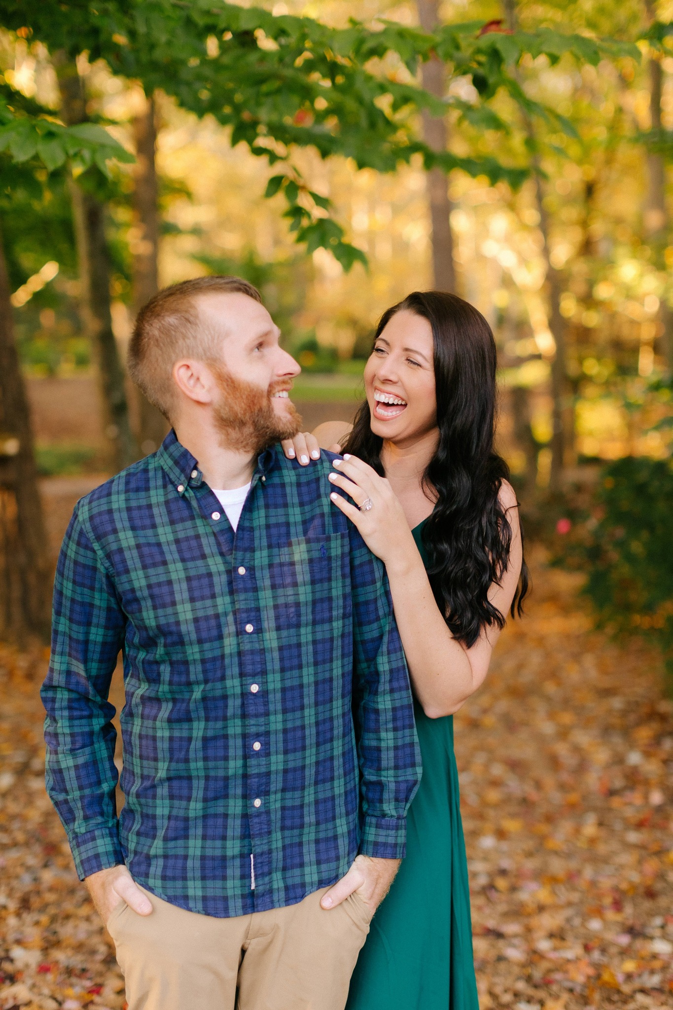 married couple laughs during NC anniversary portraits
