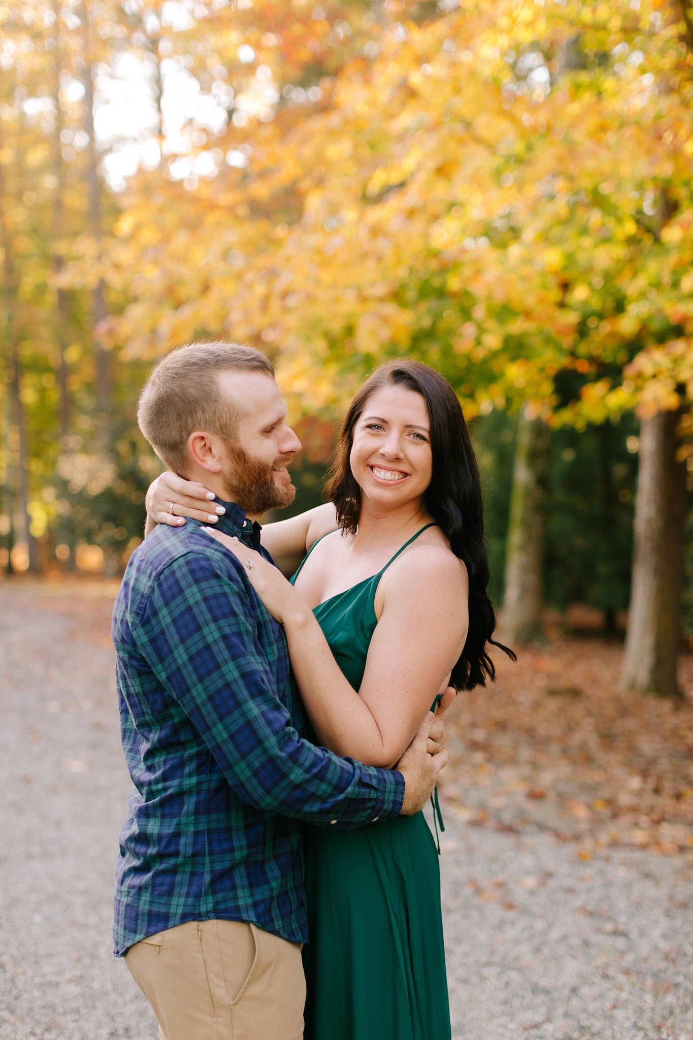 husband looks at wife during anniversary portraits 
