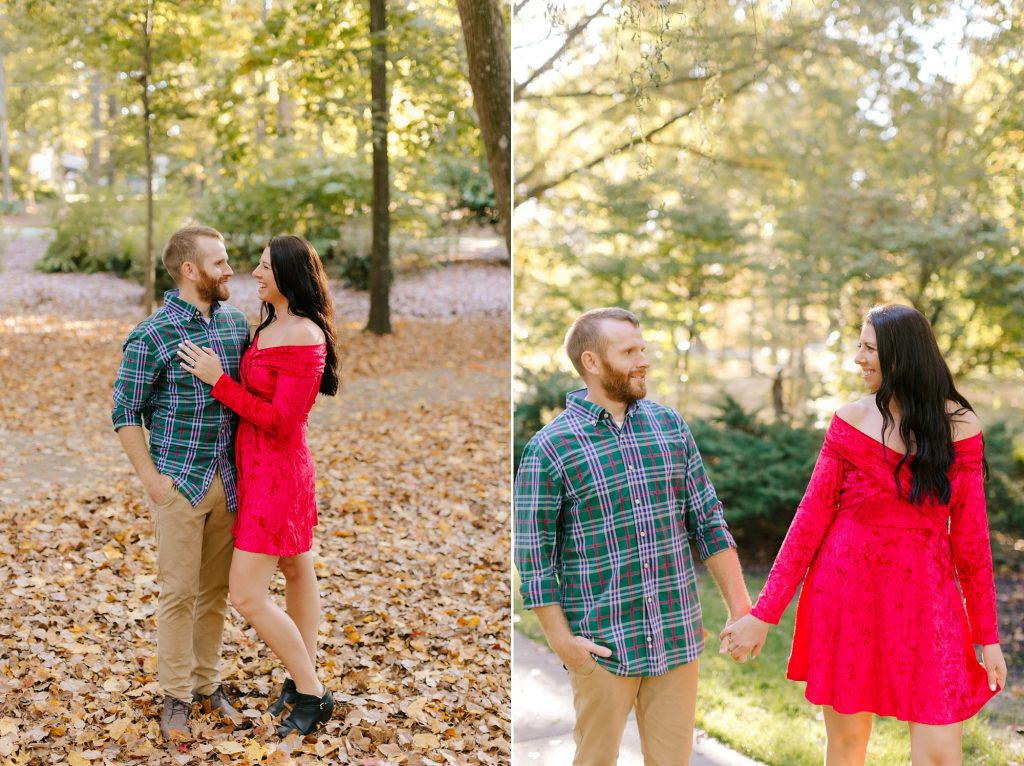 married couple walks through fall leaves during Greensboro Botanical Gardens anniversary session